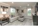 Inviting living room showcases stylish decor, comfortable seating, and plenty of natural light at 442 Serenity Cir, Cramerton, NC 28032