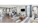 Open-concept living area with kitchen, living room, and dining space, perfect for modern living at 442 Serenity Cir, Cramerton, NC 28032