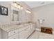 Bright bathroom featuring double sinks, granite countertops, and ample cabinet space at 9723 Sedgefield Dr, Waxhaw, NC 28173