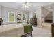 Bright bedroom with two twin beds, neutral carpet, and ample natural light from two windows at 9723 Sedgefield Dr, Waxhaw, NC 28173