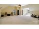 Bonus room with large open space, dormer windows and neutral walls and carpet at 9723 Sedgefield Dr, Waxhaw, NC 28173