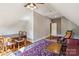 Bonus room featuring vaulted ceilings, wood floors, and a sitting area at 9723 Sedgefield Dr, Waxhaw, NC 28173