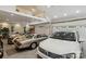 Spacious three car garage with high ceiling and white doors for storage and vehicles at 9723 Sedgefield Dr, Waxhaw, NC 28173
