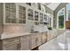 Gourmet kitchen with custom cabinets, mosaic backsplash, and marble countertops at 9723 Sedgefield Dr, Waxhaw, NC 28173