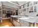 Spacious kitchen featuring a stainless steel sink, marble countertops, and eat-in dining space at 9723 Sedgefield Dr, Waxhaw, NC 28173