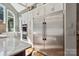 Gourmet kitchen featuring a large, stainless steel refrigerator and built-in oven at 9723 Sedgefield Dr, Waxhaw, NC 28173