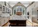 Bright kitchen featuring a large island, white cabinetry, and stainless steel appliances at 9723 Sedgefield Dr, Waxhaw, NC 28173