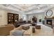 Spacious living room features coffered ceilings, fireplace, and comfortable seating area with lots of natural light at 9723 Sedgefield Dr, Waxhaw, NC 28173