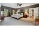 Spacious bedroom with large windows, ceiling fan and en-suite bathroom access at 9723 Sedgefield Dr, Waxhaw, NC 28173