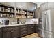 Well-organized pantry with stainless steel appliances, quartz countertops, and ample cabinet space with shelves at 9723 Sedgefield Dr, Waxhaw, NC 28173