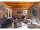 Screened porch with brick ceiling and outdoor seating area at 9723 Sedgefield Dr, Waxhaw, NC 28173