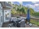 Inviting back deck featuring a comfortable sectional sofa, stylish furniture, and an umbrella for shade at 1001 Hatton Ter, Fort Mill, SC 29707