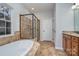 Bathroom featuring dual shower heads, a soaking tub, and a granite vanity at 1001 Hatton Ter, Fort Mill, SC 29707