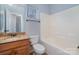 Bathroom with granite countertop and a tub with a window for natural light at 1001 Hatton Ter, Fort Mill, SC 29707