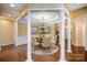 Elegant formal dining room with hardwood floors and columns at 1001 Hatton Ter, Fort Mill, SC 29707