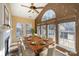 Sun-drenched dining room with large windows and wood table at 1001 Hatton Ter, Fort Mill, SC 29707