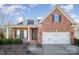 Brick home with a two-car garage and manicured landscaping at 1001 Hatton Ter, Fort Mill, SC 29707