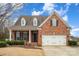 Charming brick home featuring a two-car garage and well-manicured landscaping at 1001 Hatton Ter, Fort Mill, SC 29707