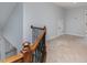 Hallway with carpet, wood railing, and black wrought iron spindles at 1001 Hatton Ter, Fort Mill, SC 29707