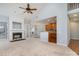 Spacious living room featuring a fireplace, built-ins, and an adjacent kitchen at 1001 Hatton Ter, Fort Mill, SC 29707