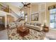 Spacious living room with high ceilings, a fireplace, and large windows at 1001 Hatton Ter, Fort Mill, SC 29707