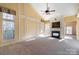 Sunlit living room featuring a fireplace and high ceilings at 1001 Hatton Ter, Fort Mill, SC 29707