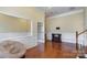 Spacious living room with hardwood floors and decorative wainscoting at 1001 Hatton Ter, Fort Mill, SC 29707