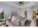 Serene main bedroom featuring a trey ceiling, carpet flooring, and a view into the ensuite bathroom at 1001 Hatton Ter, Fort Mill, SC 29707