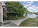 Side yard with concrete path and landscaping at 1001 Hatton Ter, Fort Mill, SC 29707