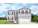 Two-story house with gray siding, red door, and white garage door at 147 Basildon St # 1007, Lancaster, SC 29720