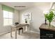 Home office with wooden desk, chair, and decorative elements at 147 Basildon St # 1007, Lancaster, SC 29720