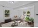 Living room with hardwood floors, neutral decor, and natural light at 1473 Polk Ford Rd, Stanfield, NC 28163