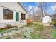 Charming backyard with shed, stone pathway, and lush greenery at 1509 Cripple Creek Rd, Kannapolis, NC 28081