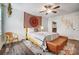 Bedroom with yellow bed frame and woven wall hanging at 1509 Cripple Creek Rd, Kannapolis, NC 28081