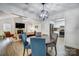 Bright dining area with kitchen view, hardwood floors, and modern chandelier at 1509 Cripple Creek Rd, Kannapolis, NC 28081