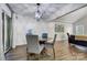 Dining area with a modern light fixture and access to the patio at 1509 Cripple Creek Rd, Kannapolis, NC 28081