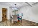 Bright dining room with a round wooden table and four chairs at 1509 Cripple Creek Rd, Kannapolis, NC 28081