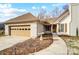 House exterior featuring a walkway, bird bath, and attached garage at 1509 Cripple Creek Rd, Kannapolis, NC 28081