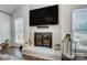 White brick fireplace with a modern black screen at 1509 Cripple Creek Rd, Kannapolis, NC 28081