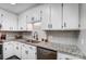 White cabinets, granite countertops, and stainless steel sink at 1509 Cripple Creek Rd, Kannapolis, NC 28081