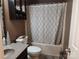 Bathroom with shower-tub combo, grey vanity and decorative accents at 2015 Pine Needle Ct, Gastonia, NC 28056
