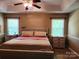 Bedroom featuring a bed, two windows, and two nightstands at 2015 Pine Needle Ct, Gastonia, NC 28056