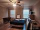 Bedroom featuring a ceiling fan, two windows and a desk at 2015 Pine Needle Ct, Gastonia, NC 28056