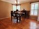 Hardwood floored dining room featuring a wooden table and bright natural light at 2015 Pine Needle Ct, Gastonia, NC 28056