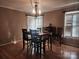 Dining room with hardwood floors, natural light, and a table for six at 2015 Pine Needle Ct, Gastonia, NC 28056