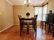 Dining room with hardwood floors, a wooden table, and bright natural light at 2015 Pine Needle Ct, Gastonia, NC 28056