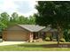 Charming single-story brick home with a two-car garage and beautifully landscaped front yard at 2015 Pine Needle Ct, Gastonia, NC 28056