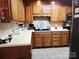 Traditional kitchen featuring wood cabinetry, stainless steel appliances, and laminate countertops at 2015 Pine Needle Ct, Gastonia, NC 28056