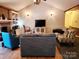Cozy living room featuring a brick fireplace, built-in shelving, and stylish seating arrangements at 2015 Pine Needle Ct, Gastonia, NC 28056