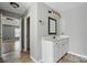 Bathroom view featuring a single sink vanity with white countertop, dark hardware, and a mirror at 3007 Gambrill Falls Dr, Indian Trail, NC 28079
